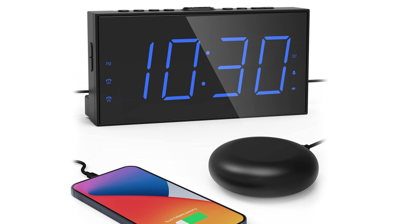 rocam vibrating clock on white background