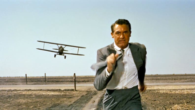 Cary Grant in "North by Northwest" (1959), one of the best thrillers to stream now, as he outruns a crop duster plane.