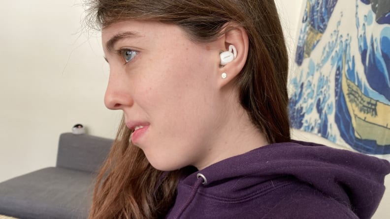 a girl with her head turned to show one of the Bose Sleepbuds II in use