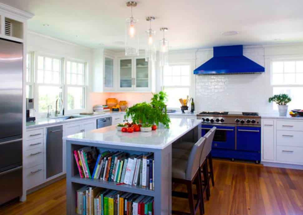 A LG oven offers a pop of color in a white kitchen