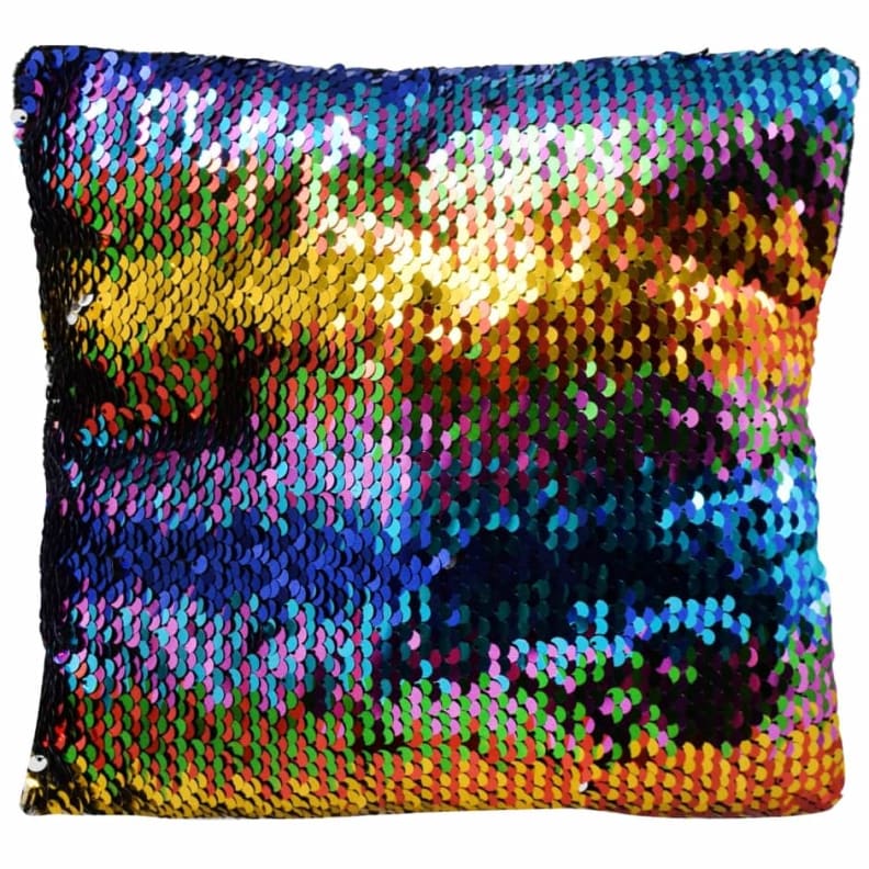 A rainbow colored sequin pillow.