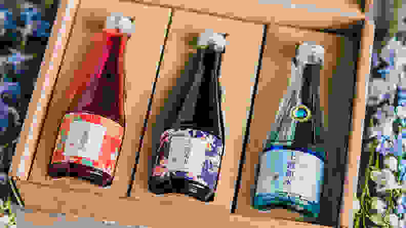 In a box, there are three bottles of Japanese sake.